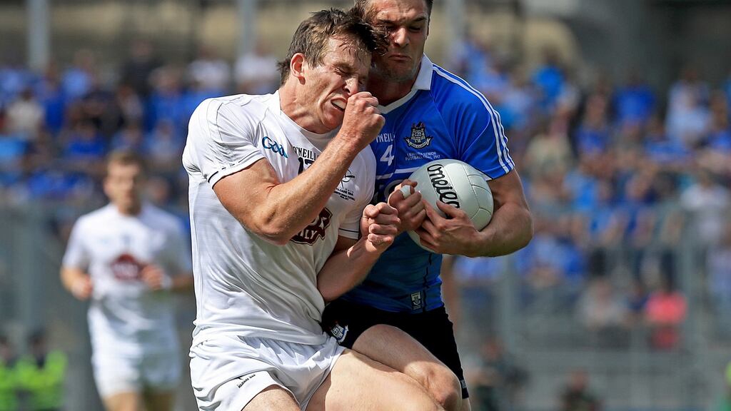 Dublin’s Eric Lowndes takes possession under pressure from Kildare’s Paddy Brophy. Photograph: Inpho/Donall Farmer
