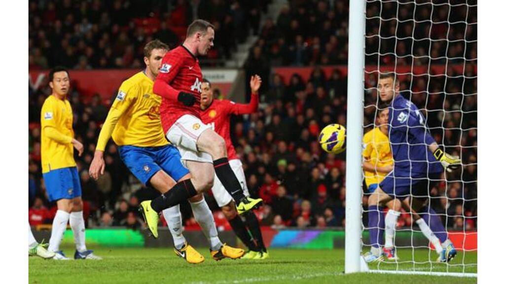 Manchester United striker Wayne Rooney scores his second goal during the Premier League match against Southampton at Old Trafford. Photograph: Alex Livesey/Getty Images