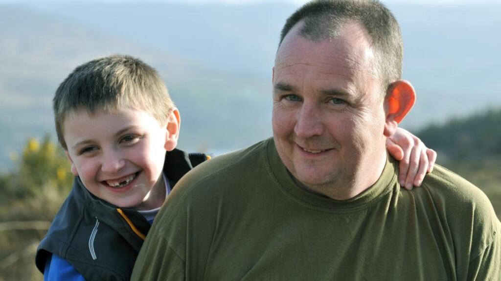 John O'Sullivan and his son Seán 'running up the hill' outside Kenmare in preparation for the Jack & Jill Foundation 10k run on April27th.  Photograph:  Don MacMonagle