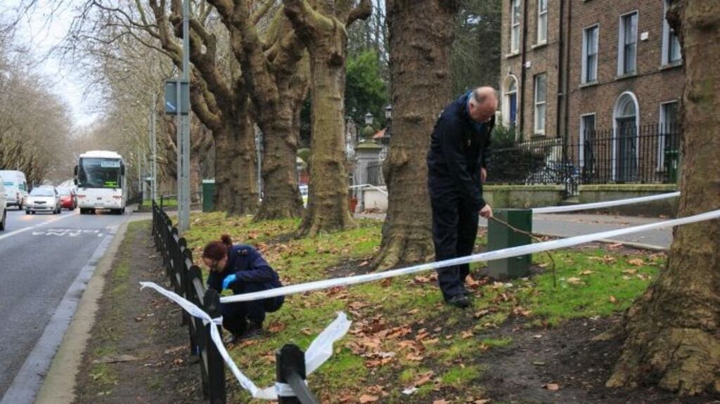 Gardaí at the scene in Drumcondra where a 36-year-old woman was stabbed as she walked home from work by another woman who demanded her handbag. Photograph: Gareth Chaney Collins