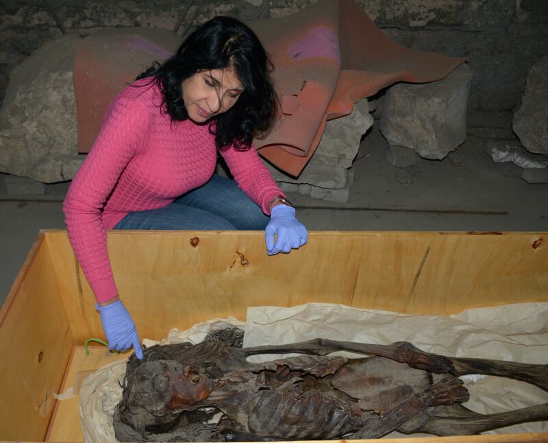 Prof Sahar Saleem with the ancient Egyptian mummy known as the "Screaming Woman". Photograph: Sahar Saleem/Cairo University/PA Wire