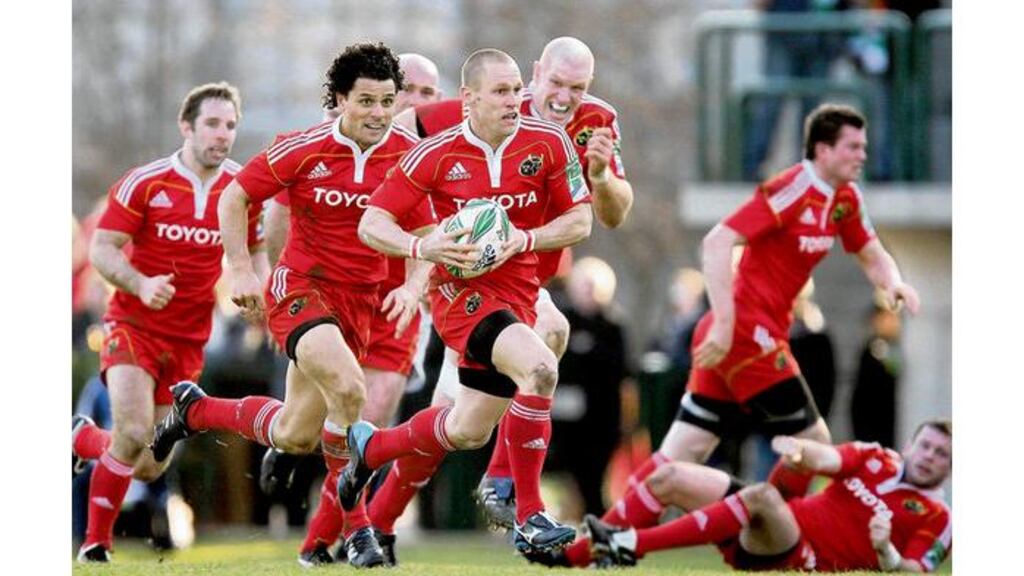Munster's Paul Warwick has plenty of support from his team-mates as he races away on his way to scoring their bonus-point try against Benetton Treviso at the Stadio Comunale di Monigo on Saturday.
