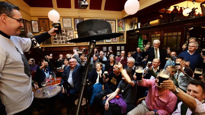 John Clarke raises a glass to Brian O’Nolan on the 50th anniversary of the publication of The Third Policeman on Mylesday at The Palace Bar in Dublin. Photograph: Cyril Byrne / The Irish Times