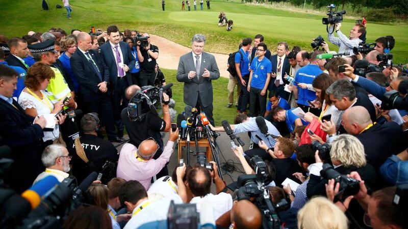 Ukraine’s president Petro Poroshenko speaks to reporters on the second and final day of the Nato summit in Wales yesterday. Mr Poroshenko confirmed on his Twitter account that envoys meeting in Minsk to end fighting between Kiev’s forces and pro-Russian separatists had signed a ceasefire agreement. Photograph: Reuters