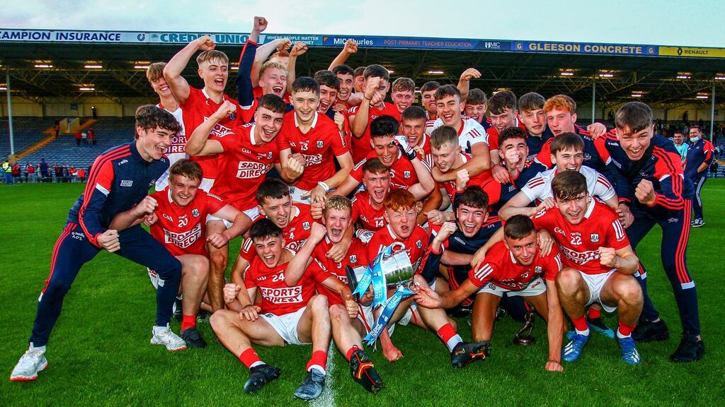 Cork players celebrate with the Tadhg Crowley Cup after their win over Limerick in the Electric Ireland Munster minor football final at  Semple Stadium in  Thurles. Photograph:  Ken Sutton/Inpho