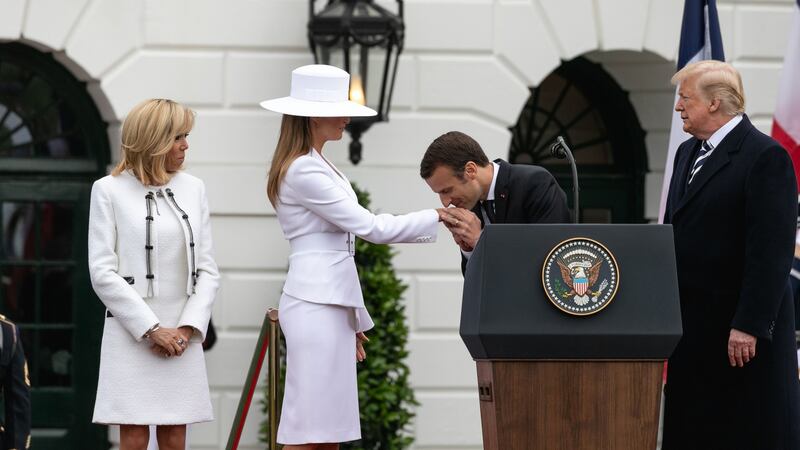 French President Emmanuel Macron kisses Melania’s hand. Photograph:  Cheriss May/NurPhoto via Getty Images