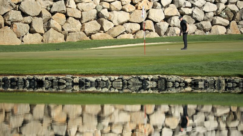 Matthew Fitzpatrick lines up his putt on the 12th green. Photo: Warren Little/Getty Images