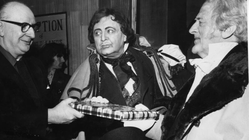 Hilton Edwards and Micheál Mac Liammóir in 1975 present a replica of the Book of Kells  to Christopher Casson to mark his 63rd birthday. Photograph: Jimmy McCormack