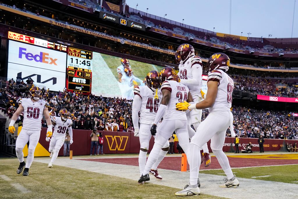 The Washington Commanders celebrate after completing a play against the Dallas Cowboys at FedExField in Maryland on January 8th. Photograph: Jess Rapfogel/Getty Images