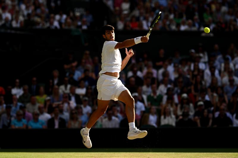 Spain's Carlos Alcaraz plays a forehand during his Wimbledon quarter-final win over Britain's Cameron Norrie. Photograph: Mike Hewitt/Getty Images