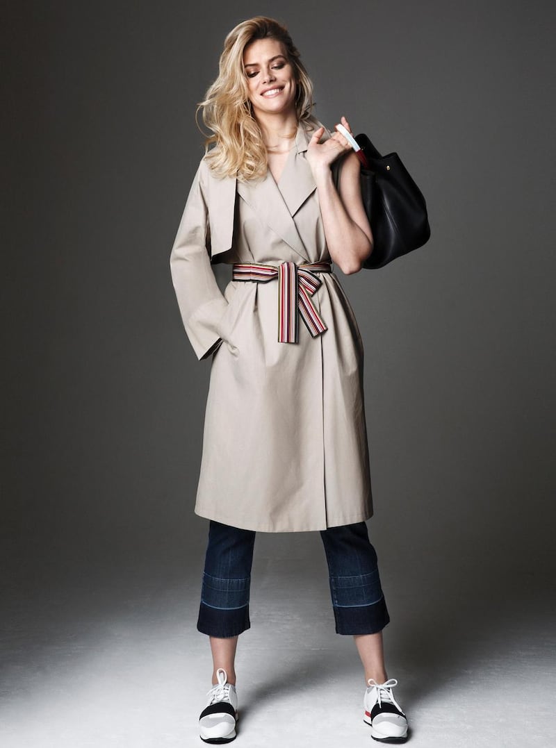 Trench coat with detachable sleeves and striped grosgrain belt €780 Marina Rinaldi, black leather bag with coloured ring handle €1,995 Marni