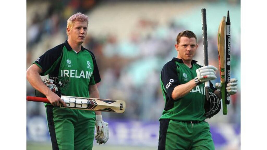 The O’Brien brothers, Kevin and Niall, head for the pavilion after guiding Ireland to victory over the Netherlands. Photograph: Deshakalyan Chowdhury/Afp/Getty Images