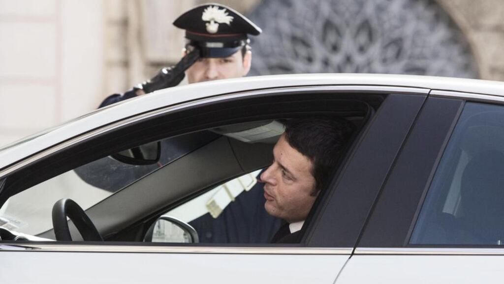 A guard salutes as Matteo Renzi, the leader of the centre-left Democratic Party (PD), arrives at Quirinal palace in Rome where president Giorgio Napolitano invited him to form a government. Photograph: Allesandro Di Meo/Reuters.