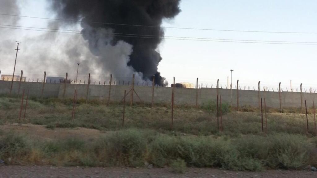 Smoke rising from the Baiji oil refinery in northern Iraq. Iraqi forces appear to be lifting the months-long siege on the country’s main oil refinery. Photograph: EPA