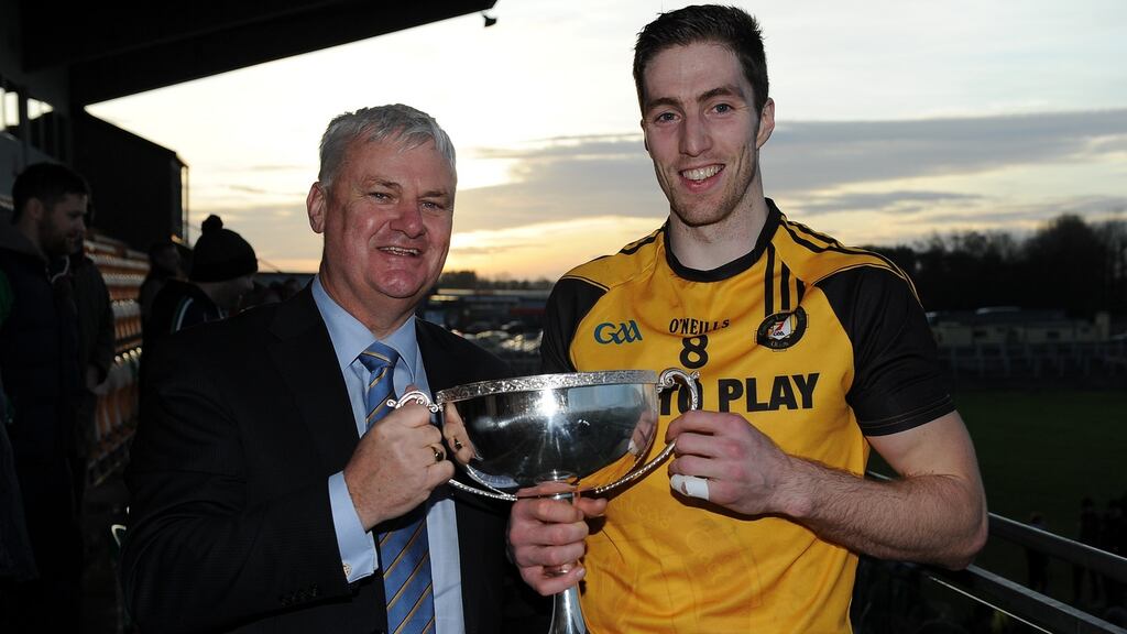 Ulster’s Eoin Donnelly is presented with the Interprovincial football cup by GAA President Aogan O’Fearghail. Photograph: Tommy Grealy/Inpho