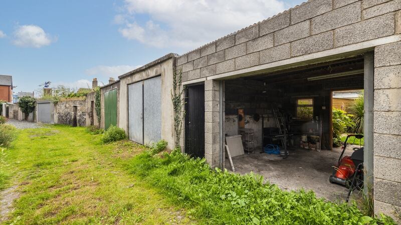 Garage with vehicular access to lane