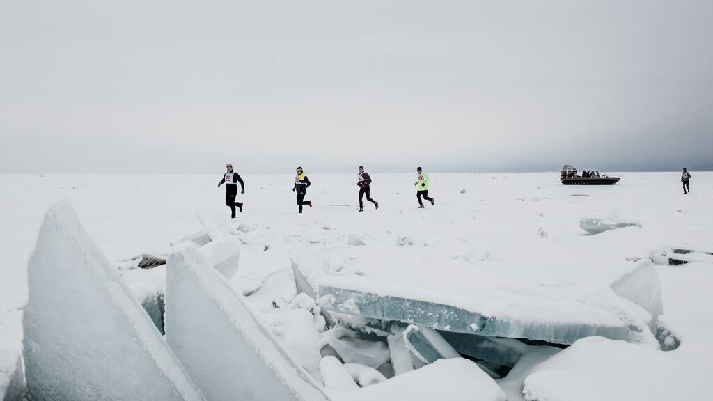 Baikal Ice Marathon participants run on the frozen surface of Lake Baikal, in Russia. It is one of the world’s most grueling races: 26 miles amid cracking ice and shifting weather. Photograph: Emile Ducke/The New York Times