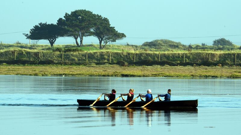 A currach near the Bull Wall bridge in Clontarf on Sunday during the unseasonably warm weather. Photograph: Cyril Byrne/The Irish Times