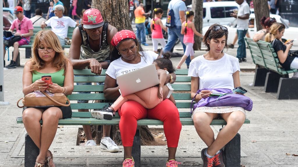 A public wifi hotspot in Havana: In 2015, the Cuban government opened the first public wifi spots. It also reduced prices and increased speeds for internet access at state-run cybercafes. Photograph: Artur Widak/NurPhoto via Getty Images