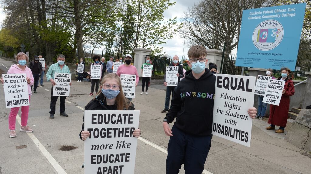 Students at Clonturk Community College Orla Fallon, from Beaumont, and James Nolan, from Drumcondra, join their parents and other supporters outside the school  to protest over not being allowed sit the Leaving Cert Applied. Photograph: Dara Mac Dónaill