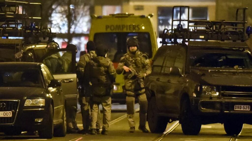Special operations police take positions during a raid in Brussels . Belgian police launched an anti-terror raid linked to last year’s Paris attacks in a Brussels neighborhood on Tuesday. Photograph: Geert Vanden Wijngaert/AP