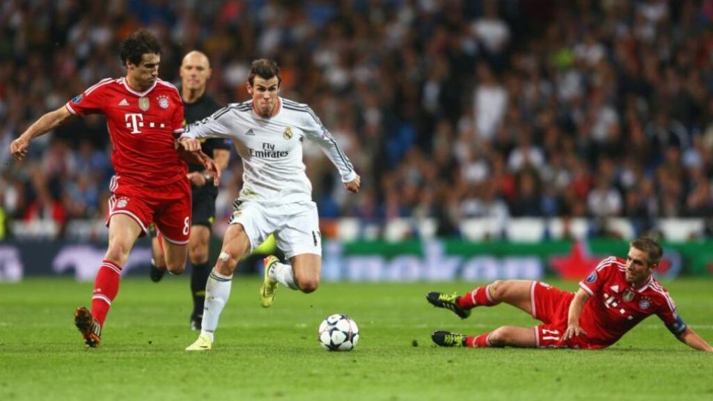 Real Madrid’s Gareth Bale holds off Javi Martinez as Philipp Lahm slides in during last week’s first-leg game at the Bernabeu.