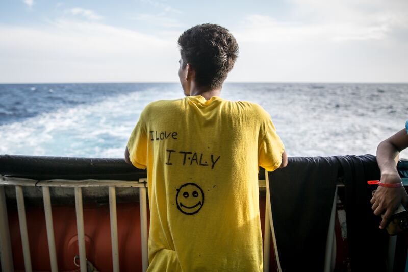 A young Bangladeshi man has written "I love Italy" on the T-shirt he was given by MSF crew. Photograph: Sally Hayden