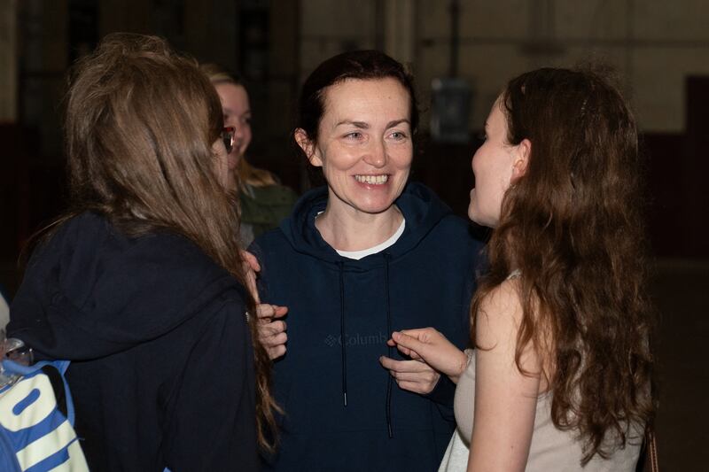 US-Russian journalist Alsu Kurmasheva (C) with her daughters Miriam Butorin (L) and Bibi Butorin after her release. Photograph: Suzanne Cordeiro/AFP