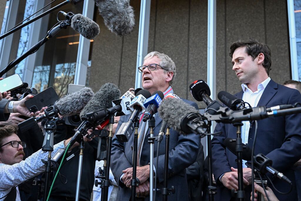 Journalists Chris Masters and Nick McKenzie outside the federal court of Australia in Sydney after Ben Roberts-Smith, one of Australia's most decorated soldiers, lost a landmark defamation case against major newspapers after a  trial that saw accusations of murder and war crimes. Photograph: Saeed Khan/AFP via Getty Images
