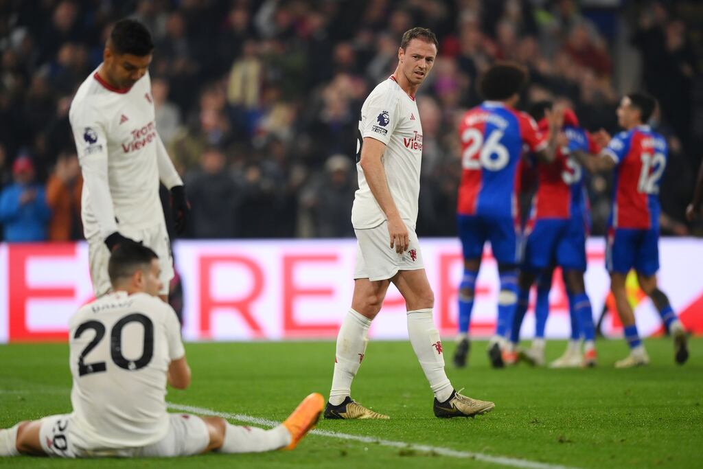 Jonny Evans of Manchester United looks dejected as he looks back towards Casemiro and Diogo Dalot after Tyrick Mitchell of Crystal Palace scored. Photograph: Justin Setterfield/Getty