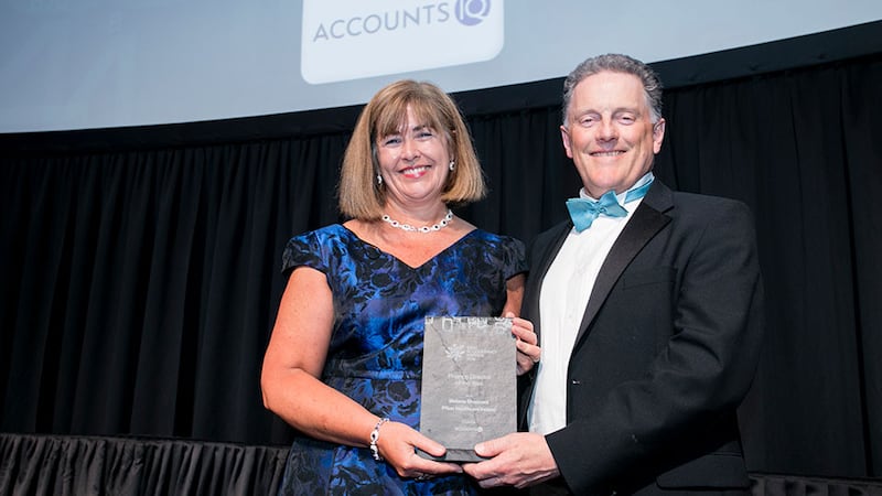 Tony Connolly, founder & CEO, AccountsIQ, presents the Finance Director of the Year award to Melanie Sheppard, Pfizer Healthcare Ireland.