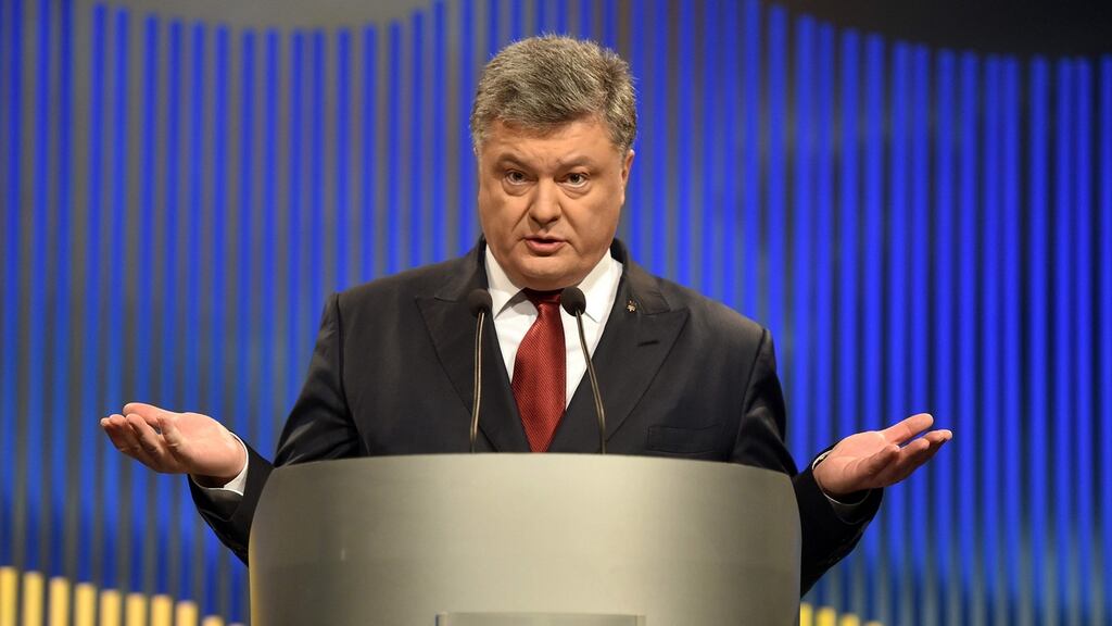 Ukrainian president Petro Poroshenko gestures during his press conference in Kiev on Thursday. Photograph: Genya Savilov/AFP/Getty Images
