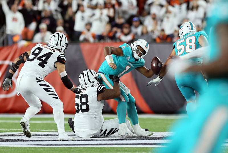 Quarterback Tua Tagovailoa #1 of the Miami Dolphins is sacked by defensive tackle Josh Tupou #68. Photograph: Andy Lyons/Getty