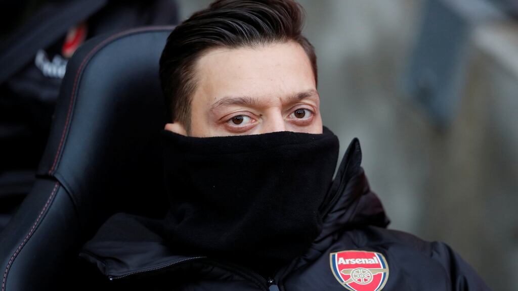 Arsenal’s Mesut Ozil   watches on the bench during his side’s  match against Southampton on December 16th. Photograph: David Klein/Reuters