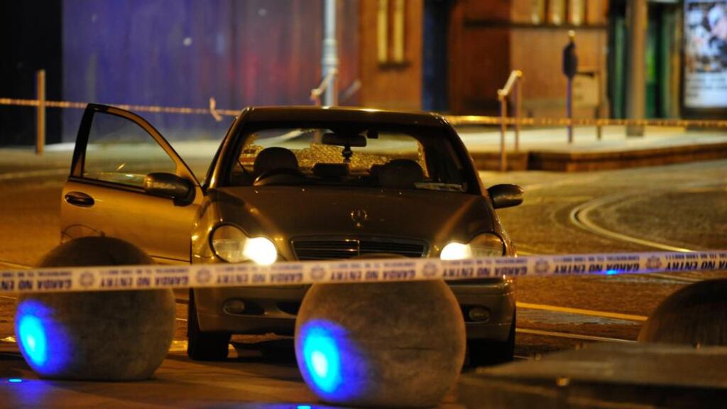 The scene at Store Street Garda Station last night where a 33-year-old man presented having been shot in the back of the head. He remains in a serious but stable condition in hospital. Photograph: Aidan Crawley