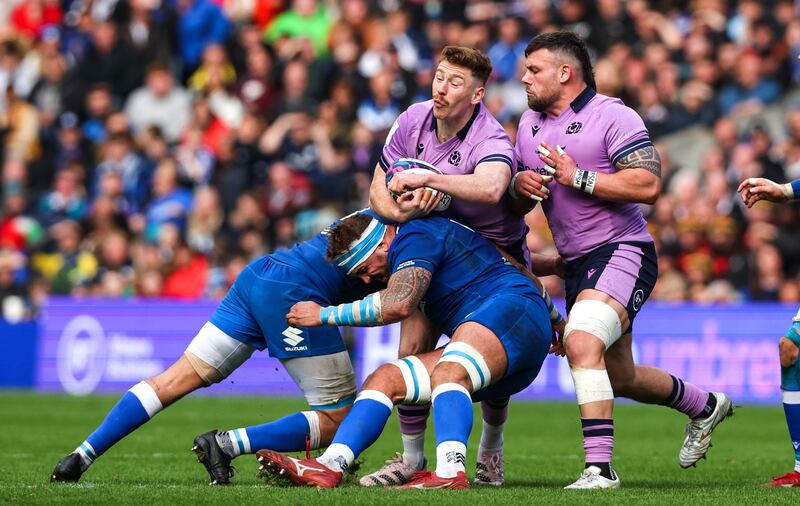 Scotland’s Ben Healy runs into heavy traffic during the Six Nations game against Italy at Murrayfield. Photograph: Tom Maher/Inpho