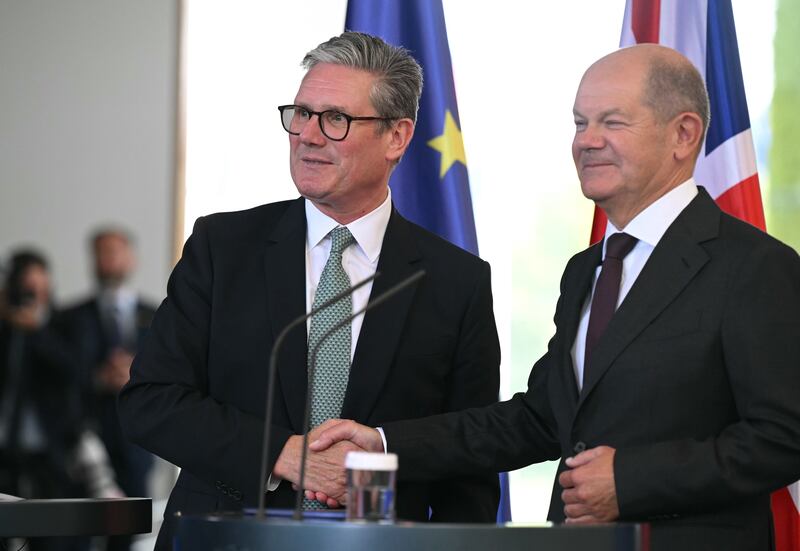 German chancellor Olaf Scholz (right) shakes hands with Starmer after a joint press conference at the chancellery in Berlin on Wednesday. Photograph: Justin Tallis/WPA Pool/Getty