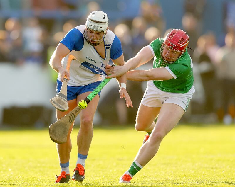 Waterford’s Dessie Hutchinson has his jersey pulled by Donnacha Ó Dálaigh of Limerick. Photograph: James Crombie/Inpho