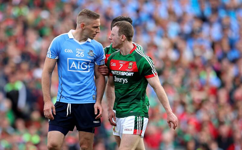 Dublin's Eoghan O'Gara and Colm Boyle of Mayo. Photograph: Ryan Byrne/Inpho