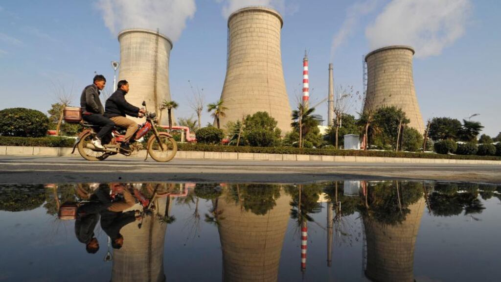 Pollution from a power plant in Xiangfan, in the Hubei province of China: the latest UN report says global mean sea levels have risen with higher concentrations of carbon dioxide.