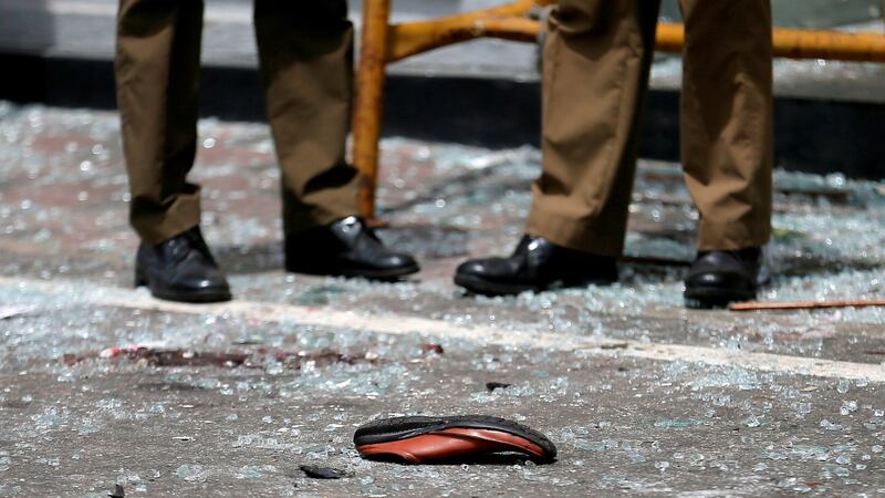 A shoe of a victim is seen in front of the St Anthony’s Shrine, Kochchikade church after an explosion in Colombo, Sri Lanka. Photograph: Dinuka Liyanawatte/Reuters