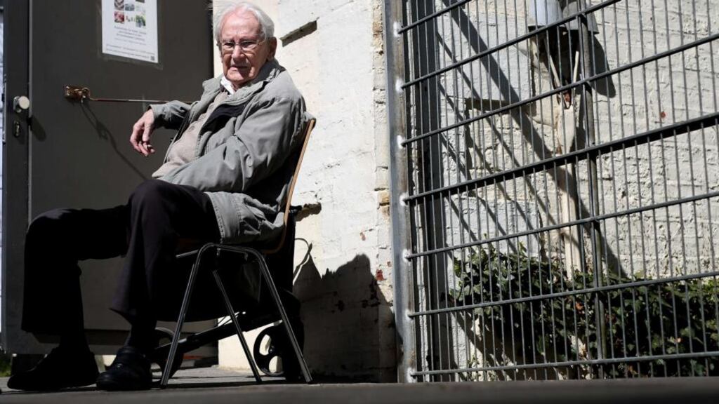 Former SS officer Oskar Gröing sits outside during a break of his trial. The 93-year-old did not contribute directly to killings but “gave the Nazi regime an economic boost” to continue its murderous campaign, the court heard. Photograph: Ronny Hartmann/AFP/Getty Images