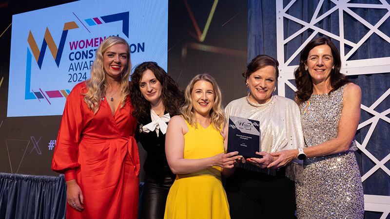 Lucy Farrell, marketing coordinator, Pennypop, presents the diversity and inclusion champion award to PM Group team