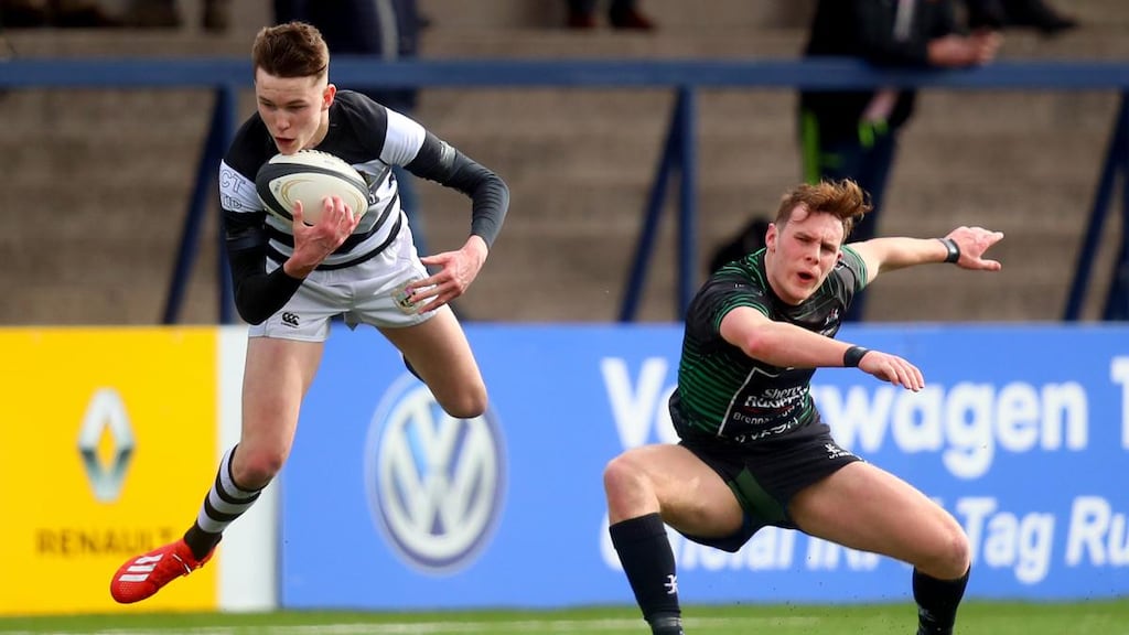 Daniel Squires of PBC catches the ball ahead of Bandon Grammar’s Harry Hall during the  Munster Schools Senior Cup semi-final at Musgrave Park. Photograph: Oisín Keniry/Inpho