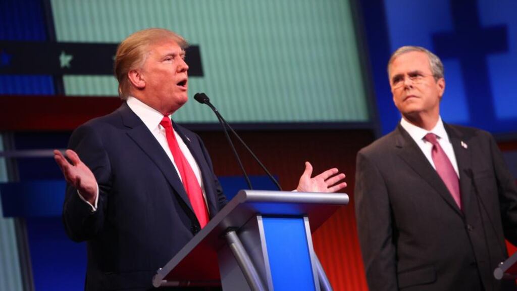 Republican presidential candidates Donald Trump and Jeb Bush participate in the first Republican presidential debate in Cleveland on Sunday. Bush has chosen to attack Trump as a false conservative. Photograph: Andrew Harnik/AP Photo