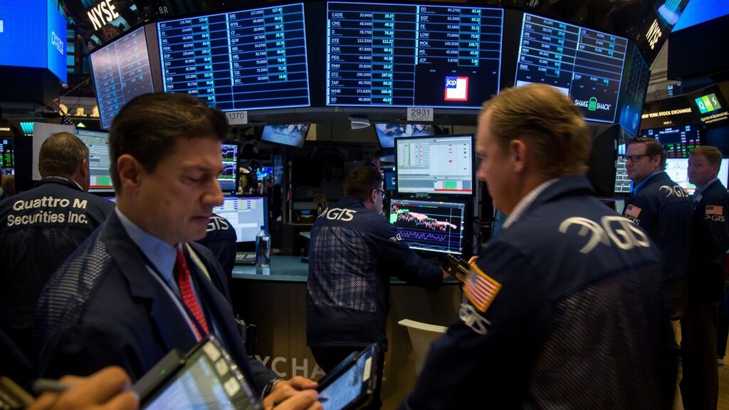 Traders working on the floor of the New York Stock Exchange recently. US markets were closed on Monday.  Photographer: Michael Nagle/Bloomberg