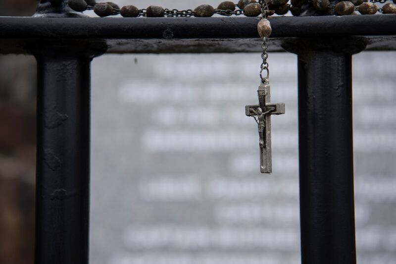 Rosary beads placed on the fence of a memorial in Knocknagoshel, where five men were killed by the IRA in 1923. Photograph: Domnick Walsh