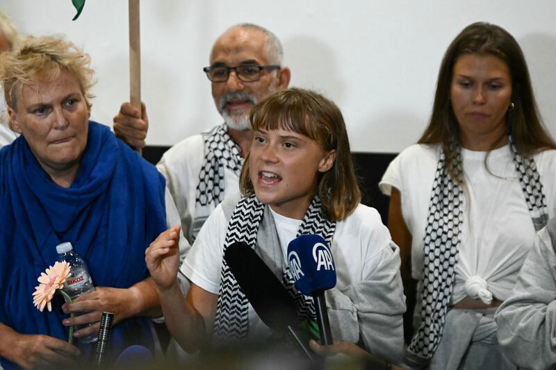 Swedish climate campaigner Greta Thunberg alongside other activists who were sailing aboard vessels in the Gaza-bound Global Sumud Flotilla following their release by Israel. Photograph: Aris Messinis/AFP via Getty