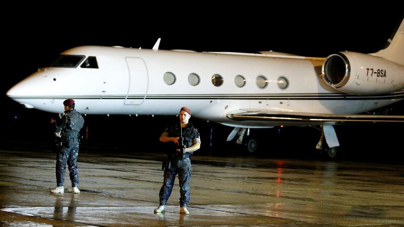 Lebanese policemen guard a jet carrying Saad al-Hariri, who announced his resignation as Lebanon’s prime minister from Saudi Arabia, at Beirut’s international airport, in Beirut, Lebanon, tonight. Photograph: Mohamed Azakir/Reuters