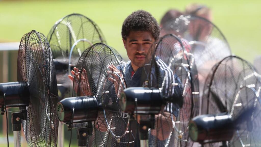 Toby Faletau cools down using mobile outside airconditioning fans during the British and Irish Lions captain’s run in Hong Kong. Photograph: David Rogers/Getty Images